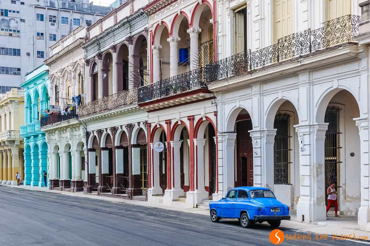 Blue car in front of colonial buildings Havana, Cuba. Travelling to Cuba
